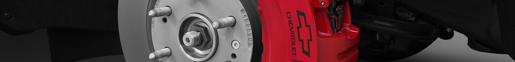 Chrome wheel hub with red Chevrolet brake caliper