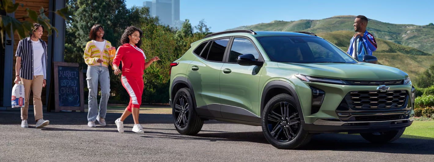 Chevrolet Trax ACTIV parked outdoors as a group of friends approaches.